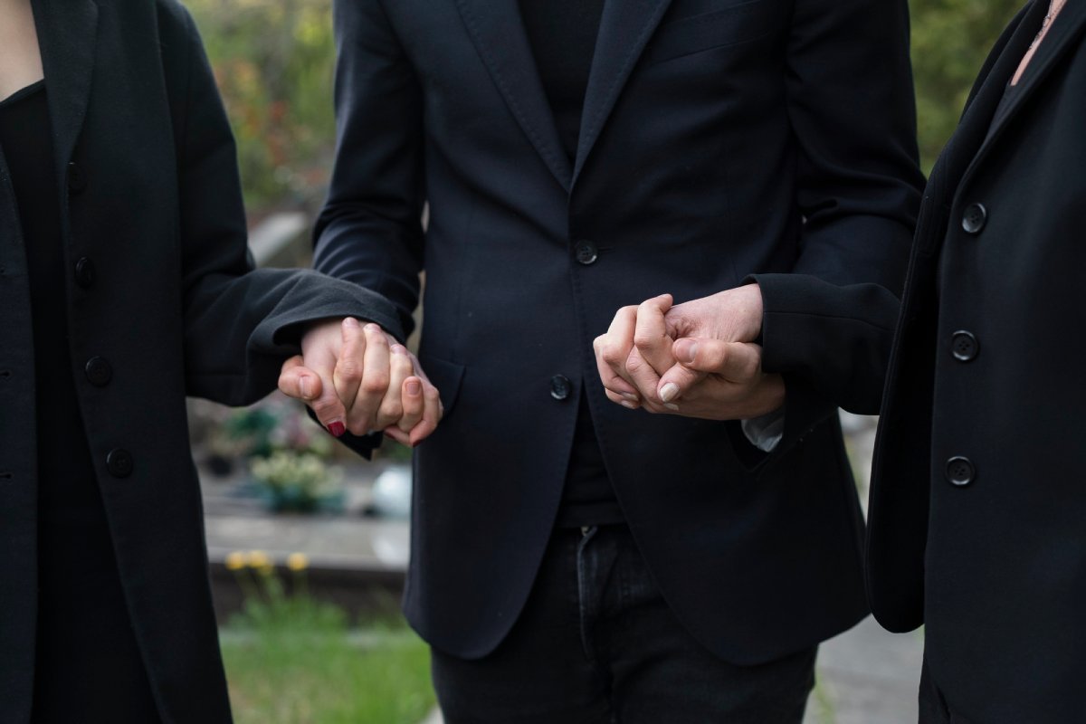 People holding hands and supporting each other